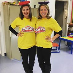 two women in yellow shirts standing next to each other