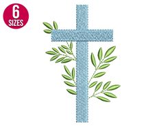 a cross with green leaves on it