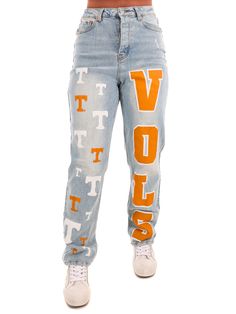 Elevate your denim game with these playful Tennessee Medium Wash Denim Jeans. The high rise fit is flattering and comfortable, while the medium wash adds a touch of classic style. And let's not forget the cheeky vols and orange and white power T painted on for an extra dose of team spirit. Go vols! 29" inseam Ripped Jeans Ideas, Senior Painted Jeans, Tennessee Outfits, Trucker Hat Fashion, Go Vols, Football Pants, Gameday Dress, Painted Jeans, Jeans Diy