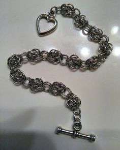 "Measures 7 \" in length with antiqued silver plated heart toggle clasp. Can customize length. Comes Gift boxed *Custom Orders Welcome*" Silver Heart Chain Bracelet In Metal, Silver Metal Heart Bracelet With Chain, Silver Heart Bracelet With Chain, Handmade Metal Heart Charm Bracelet, Nickel-free Metal Heart Bracelet, Metal Heart Bracelet With Toggle Clasp As Gift, Nickel Free Silver Metal Heart Bracelet, Silver Metal Chain Bracelet For Valentine's Day, Nickel-free Silver Metal Heart Bracelet