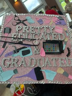 a pink graduation cap with scissors and other items on it that says happy birthday grandma