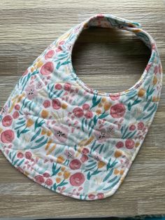 Each bib or burp cloth is made with a soft, 100% cotton flannel as a top and bottom layer with a third, absorbent layer in between. Bibs have a scooped neck line to fit your little one perfectly.  The outer edge of each bib or burp cloth is sewn down for added detail and durability. A plastic KAM snap is center on the back for an easy closure. (Snap color will coordinate with each bib)  Each item can be washed and dried. After drying, bibs can wrinkle up some and pull back out (they can also be Cotton Playtime Bib For Babies, Playful Cotton Bib, Machine Washable, Cute Cotton Bib For Playtime, Playful Cotton Bib Machine Washable, Pink Cotton Bib Machine Washable, Pink Cotton Machine Washable Bib, Multicolor Cotton Bib, Machine Washable, Playful White Cotton Bib, Cute Multicolor Machine Washable Bib