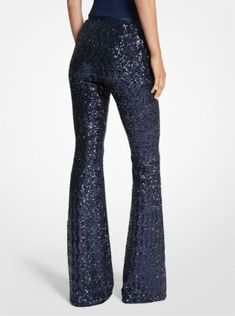 Adorned with thousands of light-reflecting sequins, these trousers deliver maximum glamour for Spring 2024. Crafted from stretch-tulle in a flattering flared-leg silhouette, they feature a concealed zip fastening for a sleek look. Consider them a modern alternative to the cocktail dress. Flare Sequin Pants For Night Out, Flared Sequin Pants For Night Out, Flare Pants With Sequins For Night Out, Fitted Embellished Bottoms For Party Season, Embellished Fitted Bottoms For Party, Embellished Fitted Bottoms For Party Season, Fall Evening Flare Pants, Flare Pants For Evening Fall Season, Flare Pants For Evening In Fall