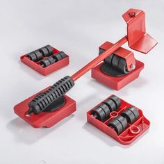 a red tool holder with tools in it on a white surface, including an open tool box and four different attachments