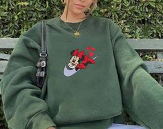 Mickey Valentine’s Day Embroidered Sweatshirts If you wish another color besides our color chart, you can note on Order Notes at checkout.  We do not accept returns or exchanges, but please message us if anything is wrong with your order! 📌 PRODUCT DESCRIPTION 📌SIZE:For the detailed sizing information, please check out the sizing chart under the photos to find the right size for you! All sweatshirts are adult unisex. If you have any questions on sizing, please contact me before placing your or Disneyland Sweatshirt, Kids Disney Shirts, Disneyland Shirt, Family Disney Trip, Disney Family Vacation, Disneyland Shirts, Mickey Mouse Sweatshirt, Embroidered Polo Shirts, Disney World Shirts