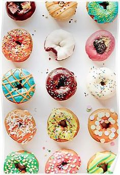 an assortment of donuts with sprinkles and toppings on white background