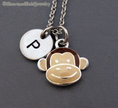 "❖ Monkey Face Charm: Silver Plated and enamel painted. Approx: 1/2\" ❖ Hand Stamped Initial Charm - Antique Silver Pewter 3/8\" (9mm) ❖ Add a birthstone or Freshwater pearl for $3.50 https://www.etsy.com/listing/110444872 ❖ Additional Hand Stamped Initial Charms $4.50 each: https://www.etsy.com/listing/107021419 ❖ Go back to Short and Bald Jewelry http://www.etsy.com/shop/ShortandBaldJewelry ❖ Your purchase will arrive attractively packaged and ready to give. ❖ FREE shipping within USA for orde Cute Silver Round Charm Necklace, Cute Silver Round Charm Necklaces, Cute Personalized Enamel Jewelry, Personalized Enamel Charm Necklaces For Gifts, Silver Enamel Round Pendant Charm Necklace, Silver Enamel Charm Necklace With Round Pendant, Cute Silver Charm Necklaces For Personalized Gifts, Silver Enamel Charm Necklace For Gift, Personalized White Nickel-free Charm Necklace