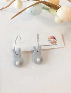 the bunny earring is on display next to some easter eggs