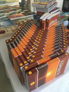 a stack of books sitting on top of a table