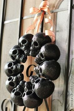 a wreath with skulls hanging from it's side