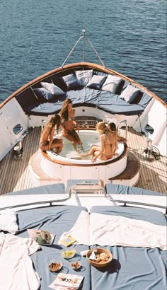 two women in a hot tub on a boat