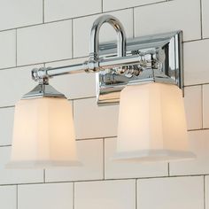 two light bathroom fixture with white glass shades