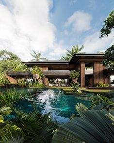 the house is surrounded by lush vegetation and trees, with a swimming pool in front