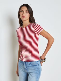 Our most flattering short sleeve tee is here, updated in a colorful stripe. In a supple microfiber and slim cut, you'll love how the Ressi crew-neck tee feels and fits. Pair with denim for the ultimate casual-chic look. Try with classic suiting for a fresh spin on professional style. | L'AGENCE Ressi Fitted T-Shirt In Red/White Stripe Trendy Short Sleeve Tops With Vertical Stripes, Spring Relaxed Fit Vertical Stripes T-shirt, Summer Vertical Stripes Short Sleeve T-shirt, Relaxed Fit Vertical Stripes T-shirt For Spring, Summer Short Sleeve T-shirt With Vertical Stripes, Everyday Fitted Striped Tops, Relaxed Fit T-shirt With Vertical Stripes For Spring, Casual Vertical Striped T-shirt For Spring, Fitted Striped Tops For Everyday