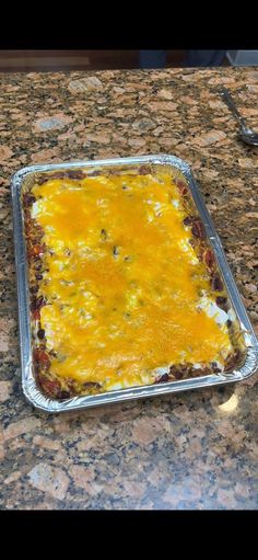 an uncooked casserole sitting on top of a counter