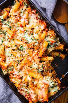 a casserole dish with cheese and spinach