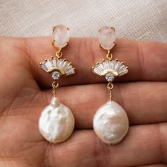 Our REESE Freshwater Pearl Earrings are so unique and drop dead gorgeous. Made with genuine rose quartz and freshwater pearl, they're made to stand out. They were designed for the classic, yet bohemian chic bride. They add a beautiful touch to every bridal look! FEATURES Genuine Rose Quartz or clear quartz post (.925 sterling post) Flat freshwater pearl Cubic zirconia fan pendant Choose from silver (rhodium-plated) or gold plated finish 100% nickel free, great for sensitive ears Jewelry Pearl Earrings, Statement Earrings Wedding, Bridal Statement Earrings, Earrings Art Deco, Deco Earrings, Freshwater Pearl Earrings, Bridal Earrings Pearl, Jewelry Pearl, Fan Earrings