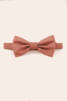 Adorably dapper, these bow ties ensure that your wedding party is fully color-coordinated. Classic Spring Party Bow Tie, Elegant Pink Bow Tie For Black Tie Events, Adjustable Solid Bow For Wedding, Elegant Pink Bow Tie Fitted, Elegant Pink Fitted Bow Tie, Elegant Fitted Pink Bow Tie, Classic Pink Bow Tie For Party, Solid Bow Tie With Decorative Bow For Wedding, Solid Color Bow Tie With Decorative Bow For Weddings