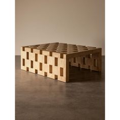 a table made out of wooden blocks sitting on top of a floor