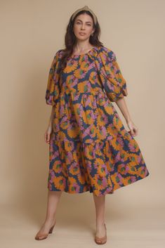 Brand: Moodie Puff sleeve midi dress with vibrant floral print. Dress has side pockets and an open back with tie. ♡ Details Color: Multi Puff sleeves Hidden side pockets Open tie back Partially lined 100% Cotton | Lining; 70% Polyester, 30% Cotton Hand wash recommended Size & Fit Model info: Height 5'3"| Bust 32"| Waist 25"| Hips 34" Model is wearing a size XS Fit: Relaxed fit Stretch: No stretch Measurements: XS: Bust = 35" | Waist = 34" | Length = 42.5" S: Bust = 36" | Waist = 35" | Length = 4 Multicolor Floral Print Dress With Balloon Sleeves, Multicolor Balloon Sleeve Dress For Brunch, Floral Print Puff Sleeve Maxi Dress For Brunch, Puff Sleeve Maxi Dress With Floral Print For Brunch, Casual Floral Print Dress With Balloon Sleeves, Multicolor Dresses With Gathered Sleeves For Brunch, Puff Sleeve Midi Dress With Floral Print For Brunch, Puff Sleeve Floral Midi Dress For Brunch, Brunch Floral Print Midi Dress With Puff Sleeves