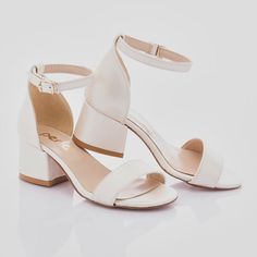 The Pearl White Sandal-Strap Heels designed by Perla are the perfect choice for special occasions and dressing up. These elegant shoes feature a block heel that provides stability and a sandal buckle strap for a snug fit, ensuring comfort throughout the day. The matching strap across the front of the foot adds a touch of sophistication to the design, while the gold logo print on the sole adds a hint of luxury. Ideal for parties, weddings, or any formal event, these Pearl White Heels will make any outfit stand out. Crafted with attention to detail and style, these heels are a must-have addition to any young fashionista's wardrobe. The Pearl White Sandal-Strap Heels designed by Perla for kid girls combine elegance and practicality, making them a versatile and stylish choice for any special o Heels Small Heel, Hoco Shoes, Cream Heels, Dama Dresses, Elegant Shoes, Wedding Heels, White Heels, White Sandals, The Pearl