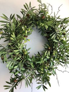 an olive wreath is hanging on the wall