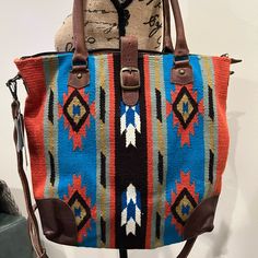 Nwt Large American Darling Blanket Bag. 2 In 1 Bag. Can Be Used As A Shoulder Or Crossbody Bag. Beautiful Crossbody Aztec Design Blanket And Leather Bag With Removable/Adjustable Leather Strap Leather Corner Trims On The Bottom Of The Bag For Added Protection. Exterior: Zip Closure And Snap Closure, Interior: Zip Pocket And Side Pockets. Lots Of Room! Approx: 16” H X 17” L Smoke Free Home Bohemian Orange Bags With Leather Handles, Orange Shoulder Bag With Leather Handles For Shopping, Orange Tote Satchel With Leather Handles, Orange Satchel With Leather Handles Tote, Orange Leather-handled Tote Satchel, Orange Leather-handled Satchel Shoulder Bag, Bohemian Orange Bag For Shopping, Orange Double Handle Leather Shoulder Bag, Bohemian Orange Shopping Bag