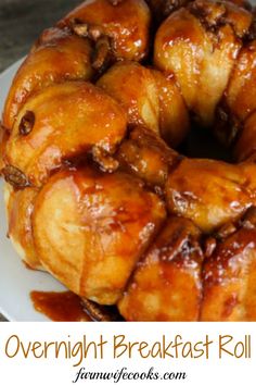 a close up of a bundt cake on a plate with caramel glaze