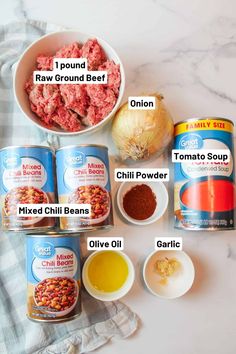 ingredients to make ground beef soup laid out on a white marble counter top with text