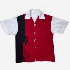 Very Rare Vintage Red Black And White Button Up Shirt With Al Pacino Scarface Graphic On The Front And Metal Gun Shaped Buttons. Made Of A Relatively Lightweight Material With A Decent Amount Of Stretch. No Tags, See Measurements For Sizing. Fits About An Xl. Excellent Condition Measurements: Length: 30” Chest: 23.5” Hem: 22.75” Shoulder: 22.25” Sleeve: 10” Bundle Deal Info In Bio Red Graphic Print Button-up Top, White Camp Shirt With Spread Collar And Button Closure, White Camp Shirt With Spread Collar, White Button-up Camp Shirt With Placket, White Shirt With Graphic Print And Spread Collar, Red Graphic Print Collared Top, Red Collared Top With Graphic Print, Red Collared Flannel Shirt, Collared White Short Sleeve Shirt With Button Closure