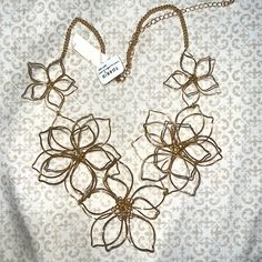 New Torrid Gold Floral Statement Neckless Flower Shaped Metal Necklaces For Parties, Flower Shaped Metal Necklace For Party, Chic Spring Wedding Necklaces, Adjustable Gold Flower Necklace For Spring, Spring Adjustable Gold Flower Necklace, Gold Metal Flower Necklace For Party, Gold Flower Shaped Chic Necklace, Gold Bohemian Flower Necklace For Party, Chic Gold Flower Necklace