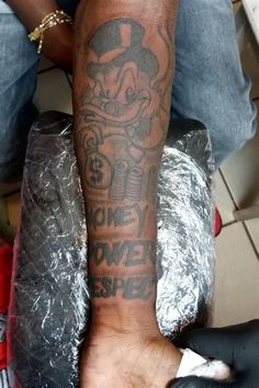 a man with a tattoo on his arm