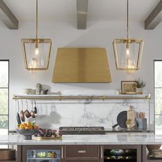 a kitchen with marble counter tops and gold pendant lights