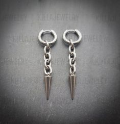 Stunning silver spike and chain link earrings! Unisex. Sold as a pair  Made of high quality stainless steel. Spike measures 21mm hoops measure 15mm  Please don't hesitate to contact me with any queries or suggestions 😊  Comes gift wrapped 💜 Modern Silver Metal Piercings, Tarnish Resistant Metal Dangle Cartilage Earrings, Minimalist Silver Metal Piercings, Edgy Silver Metal Piercings, Silver Metal Dangle Piercings, Silver Dangle Metal Piercings, Punk Style Metal Dangle Piercings, Punk Metal Dangle Piercings, Silver Dangle Stainless Steel Piercings