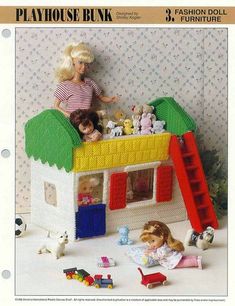 the doll house is made out of legos and has many toys on top of it