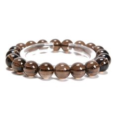 "Check out our Coupon Codes Below! Material: Natural Smoky Quartz (Not Treated or Dyed)  Beads Shape: Smooth Round Color: Brown Size: 8mm - Approx 25 Beads Per 7.5\" Bracelet 10mm - Approx 20 Beads Per 7.5\" Bracelet The Smoky Quartz Mined in Brazil Note:  -Gemstone bead sizes are approximate and may have a +/- 0.5mm difference.   -Gemstone bead drill hole sizes are approximate and may have a +/- 0.2mm difference. Use our Coupon Codes for Big Savings! 10% off when you spend $50LRC10 15% off when Bead Sizes, Gem Show, Rose Quartz Beads, Precious Gemstones, Smoky Quartz, Bracelet Sizes, Post Office, Bracelet Set, Round Beads