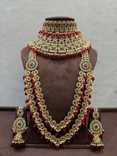 a necklace and earring set on display