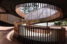 the spiral staircases are made of wood and metal, making them appear to be curved