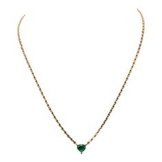 This is part of Chairish’s Fine Jewelry assortment.  Meet our favorite chain. This one has a beautiful, brilliant green emerald heart at center. It's the necklace that layers perfectly both with an every day tennis necklace and a long chunky chain. You will quickly feel that it's the piece you can't be without.   14K Gold; ; .82 Ct Emeralds; 13 - 16 inches Classic Green Jeweled Necklace, Green Heart-cut Emerald Necklace, Formal Green Heart Pendant Necklaces, Formal Green Heart Pendant Necklace, Emerald Color, Tennis Necklace, Accessories Jewelry Necklace, Green Emerald, Heart Necklace