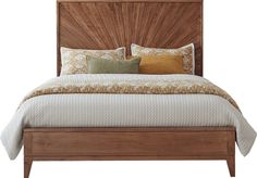 a bed with wooden headboard and pillows on it's sides, against a white background