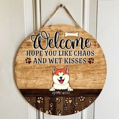 a wooden sign that says, welcome hope you like chaos and wet kisses with a dog's face on it