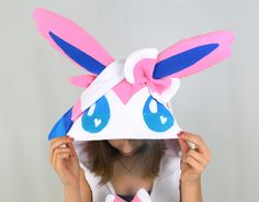 This Sylveon dress is extra cute! It can be made with the regular pink color scheme, or with a Shiny color scheme! It comes with bright pink pockets, and a little tail. This handcrafted dress is perfect for a casual cosplay, geeky parties and events, or for snuggling up at home! This custom item is made with high-quality anti-pill fleece, and it can be made to your measurements! (Please specify your bust/waist/hip measurements and height in the comments when ordering.) All dresses are equipped w Fairy Pokemon, Cosplay For Women, Pink Color Schemes, Easy Costumes, Casual Cosplay, Fairy Dress, Women's Costumes, Custom Items, Bright Pink