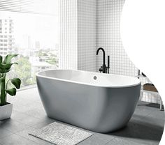 a white bath tub sitting in a bathroom next to a window and potted plant