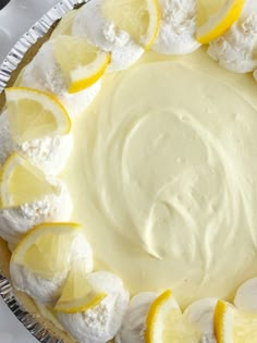 a pie with lemons and meringue on top is ready to be eaten