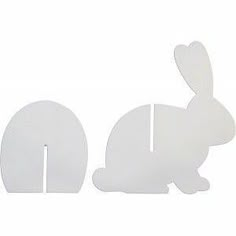 two white rabbits are standing next to each other on a white background and one is facing the opposite direction