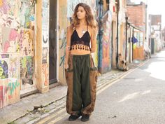 Urban inspired cotton harem pants in a with a parachute style leg. Featuring a funky aztec tribal print on the side and pockets. These super comfortable trousers have a relaxed, baggy fit with an elasticated drawstring waist and has a slightly gathered ankle without elastic. The pockets on the sides are have plenty of room for your phone wallet and other belongings and close with coconut shell button. These harem pants are unisex and will fit a range of sizes. Please note these trousers have a l Summer Streetwear Harem Pants With Cargo Pockets, Bohemian Cargo Pants With Pockets For Festival, Festival Wide Leg Parachute Pants With Pockets, Baggy Casual Cargo Pants For Festivals, Bohemian Cargo Pants For Festivals, Baggy Casual Parachute Pants For Festivals, Casual Baggy Parachute Pants For Festival, Baggy Parachute Pants With Pockets For Festivals, Baggy Hippie Harem Pants With Pockets