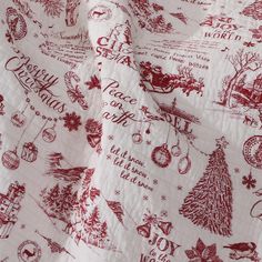 a red and white fabric with christmas designs on it