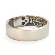 a silver ring with a skull on it