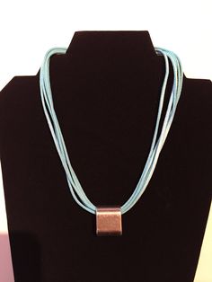 Suede multi strand necklace with silver color pendant - item is shipped with a choice of 2 necklaces (your choice of color) and one pendant (as shown on necklace).   Suede necklace available colors are black, grey, pink, red, camel, beige, light blue.  If there is a color you want and it is not listed, please write me and I will see if I can make it.  Necklace measure approximately 16" and has a 2" extension. Suede Necklace, Beige Light, Multi Strand Necklace, Strand Necklace, Multi Strand, Pink Red, Black Grey, Silver Color, Camel