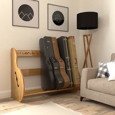 a living room filled with furniture and pictures on the wall next to a guitar case